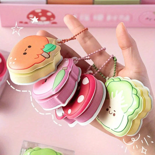 Fun Colorful cartoon-style notepads shaped like food items held by a hand.