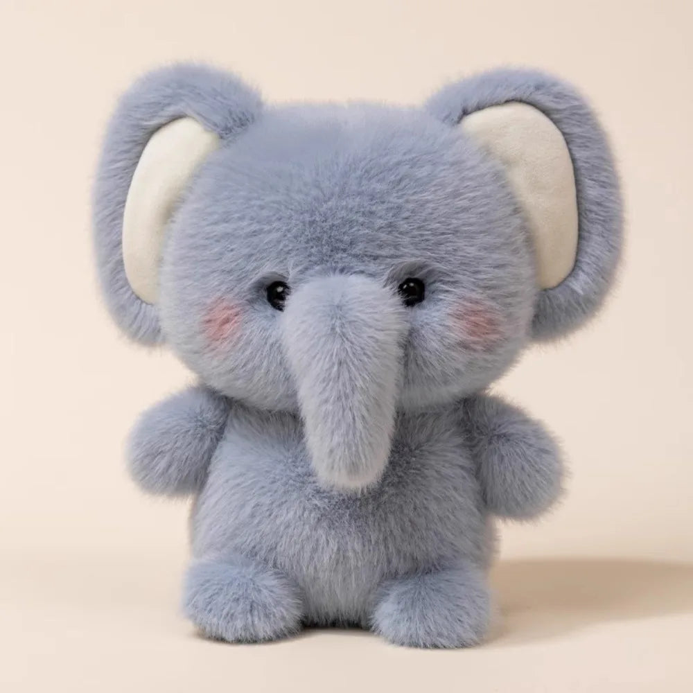 Cute Small Vintage Blue Plush elephant toy on a beige background