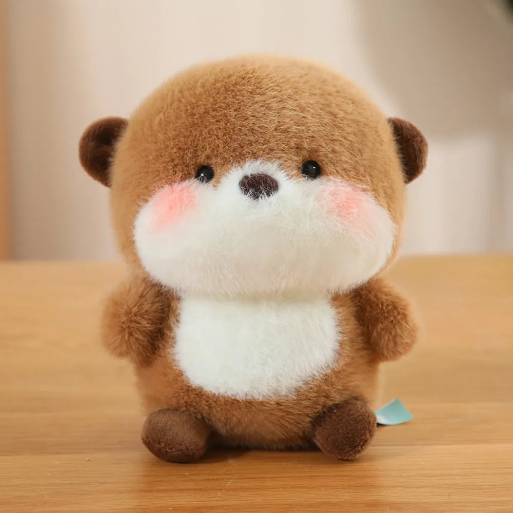 Super Cute Small Plush Toy Brown with white belly otter on a wooden surface with a blurred background