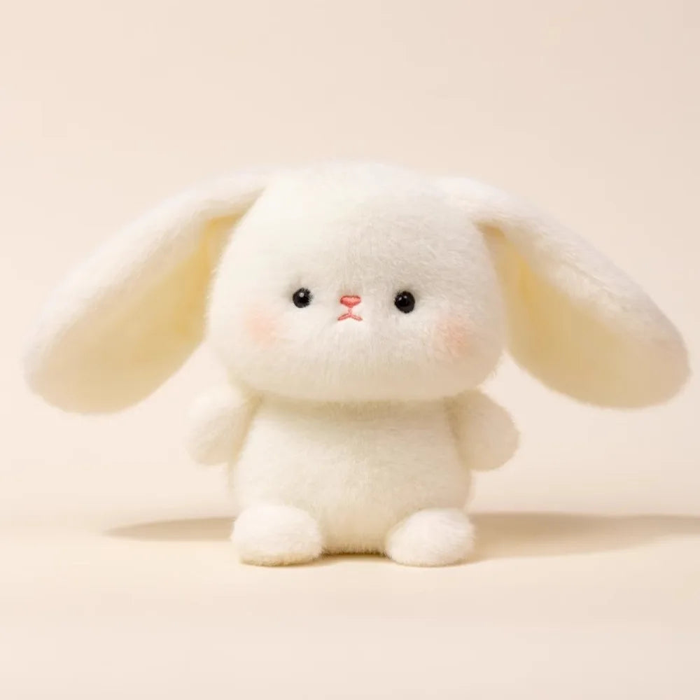 Super Cute Small White plush bunny toy big ears on a beige background